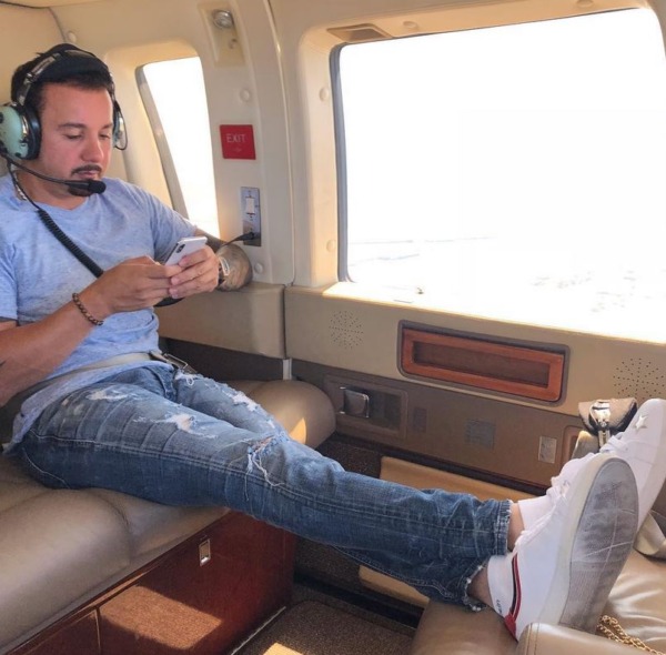 tony posting an update to his social media followers while flying in his private jet 