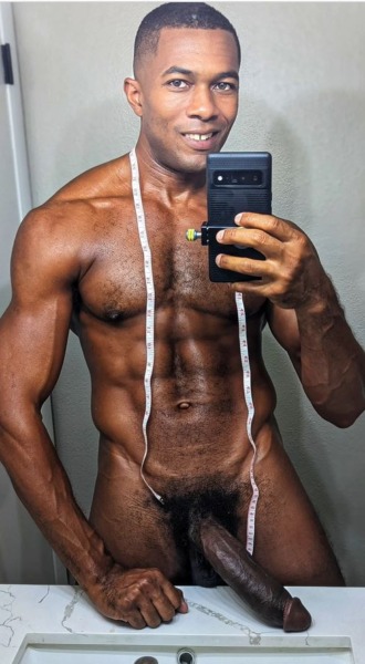 Sean Xavier naked with hard cock on bathroom bench